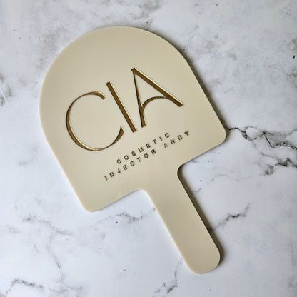 Custom Handheld Mirror with Logo for Injectable Clinic - Arch handheld mirror in beige acrylic with Gold logo